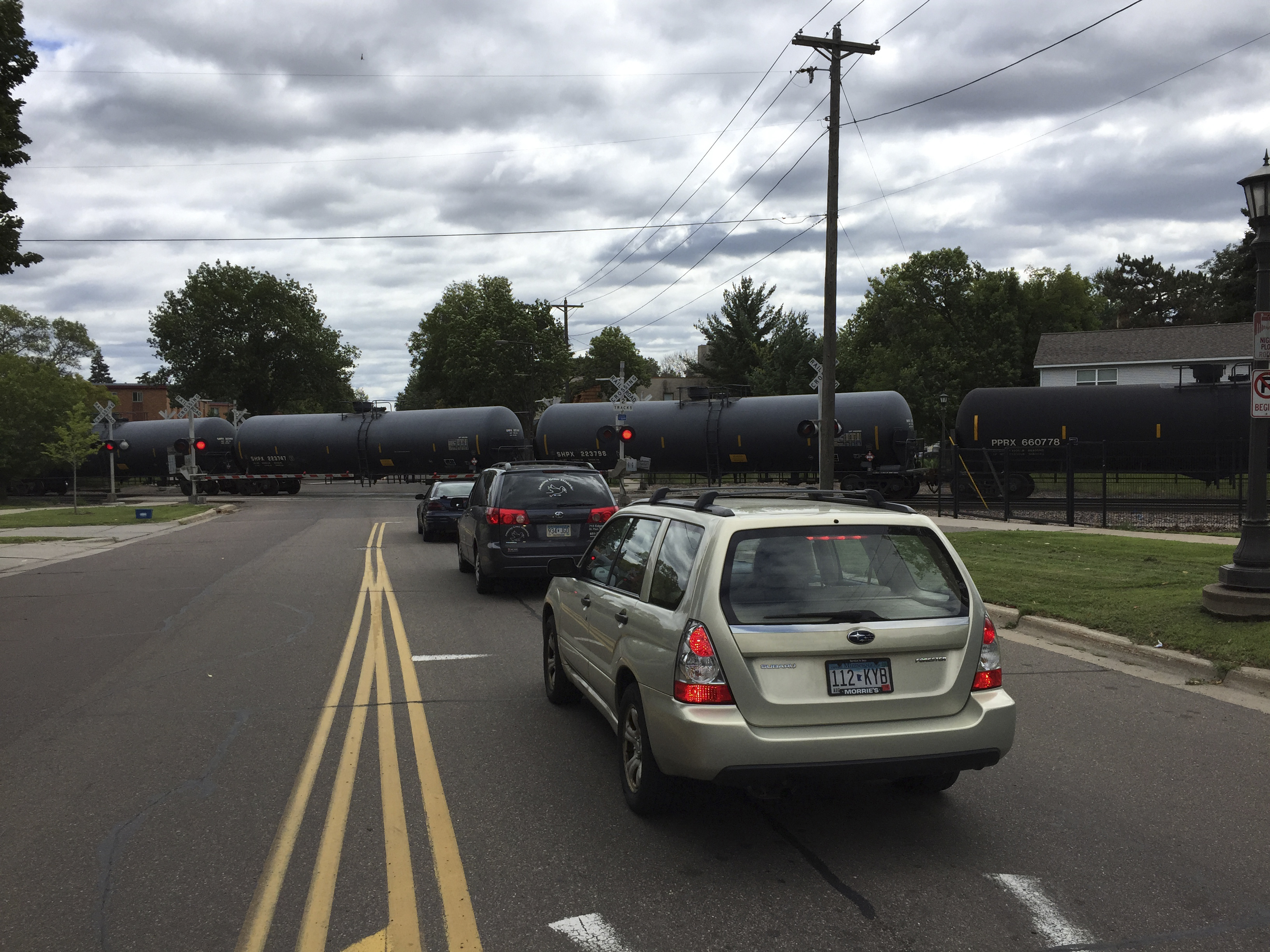 An oil train chugs through a residential St. Paul neighborhood. House Photography file photo